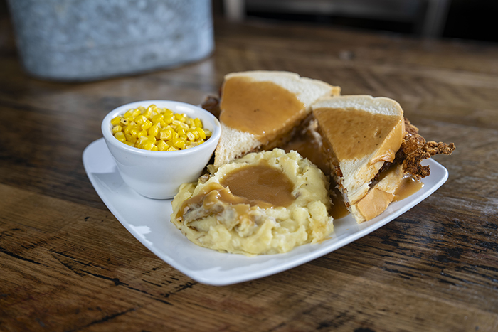 Our famous hand-breaded pork tenderloin, fried golden and served between bread, smothered in gravy, served with creamy mashed potatoes and a seasonal veggie.